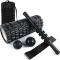 Black foam fitness roller with six-piece gear design, 33cm length, for massage and recovery.