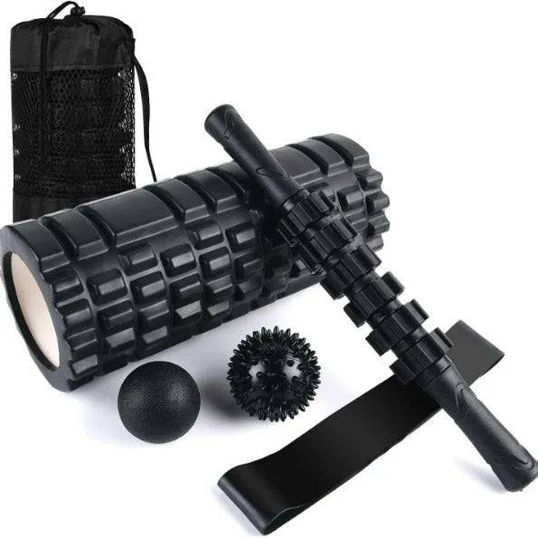 Black foam fitness roller with six-piece gear design, 33cm length, for massage and recovery.