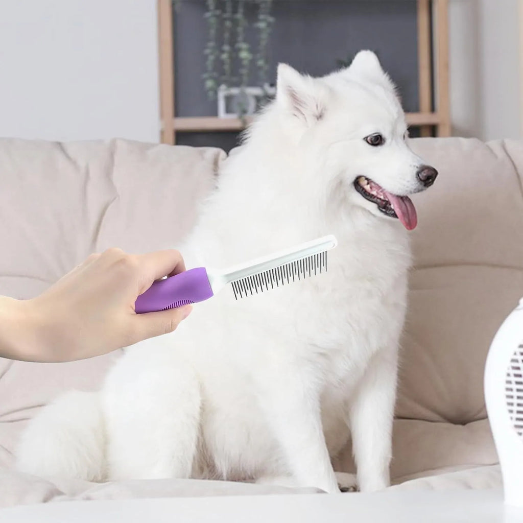 Purple pet grooming comb with stainless steel teeth on white background showing long and short tooth design