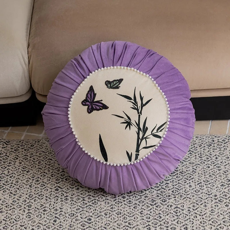 Square embroidered cushion with butterfly floral pattern in Chinese style, shown in beige colour.