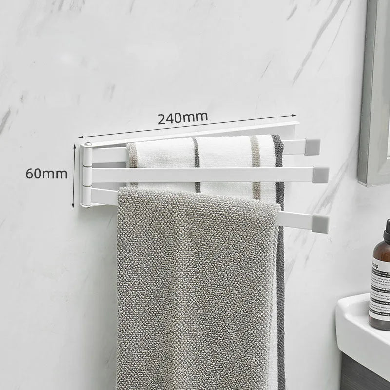 Black folding towel bar mounted on a bathroom wall with adhesive, shown in extended and folded positions.