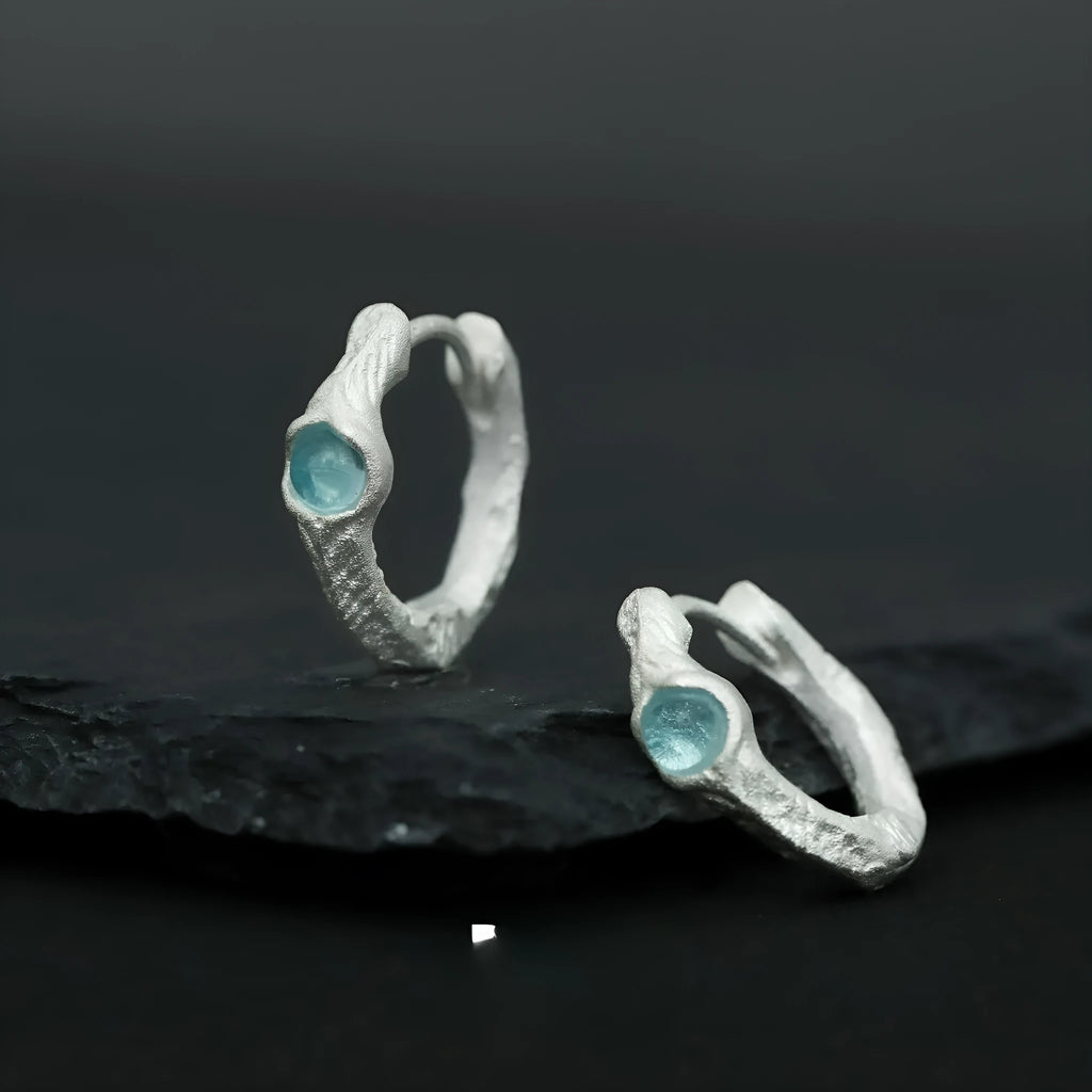 Geometric burnt silver ear clip for women, made from 925 sterling silver with a round design element.