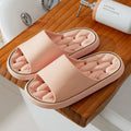 Non-slip EVA bathroom slippers with thick sole and hollow upper, available in seven colours and five sizes.