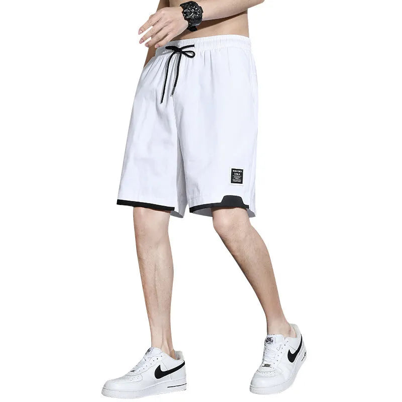 Cotton shorts for teenage boys in black, khaki, and white, showing mid-waist fit and shorts length.
