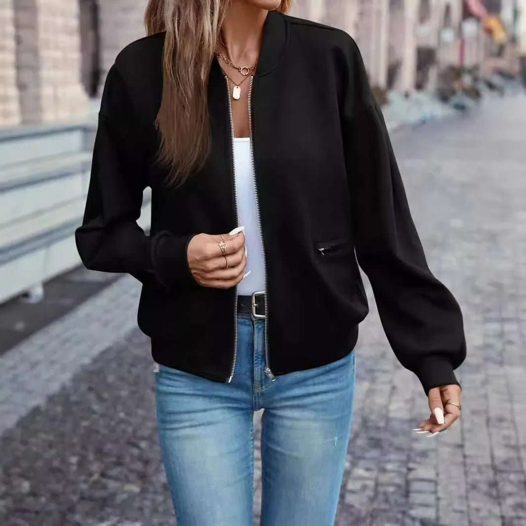 Women's solid black casual zip jacket with faux pockets and long sleeves
