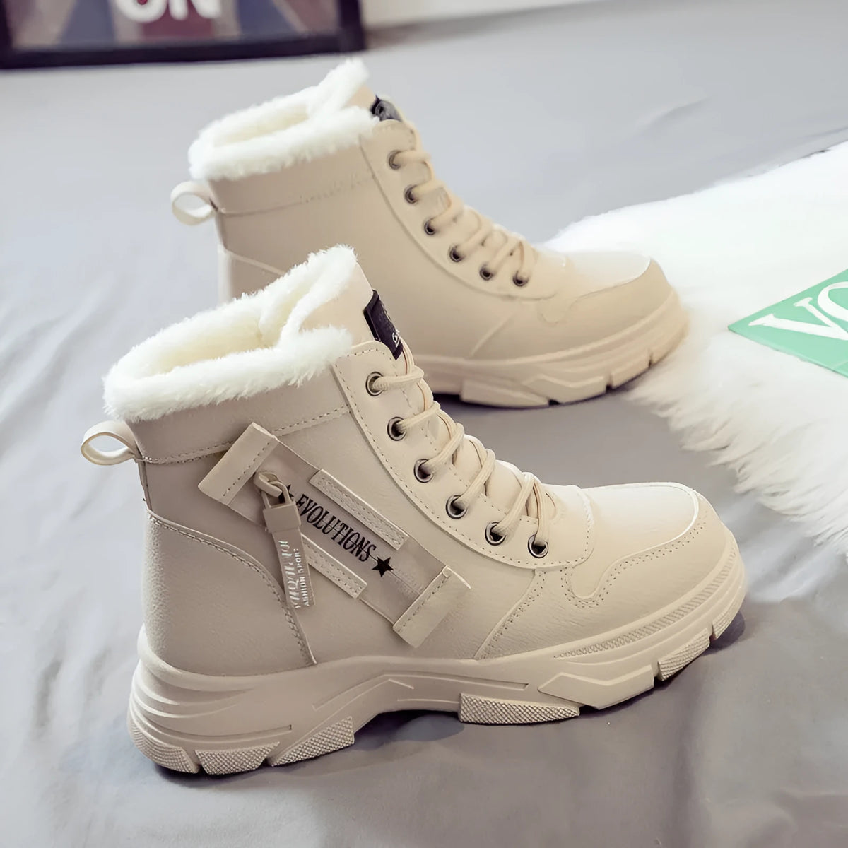 Plus size women's snow boots in black with fleece lining and lace-up front