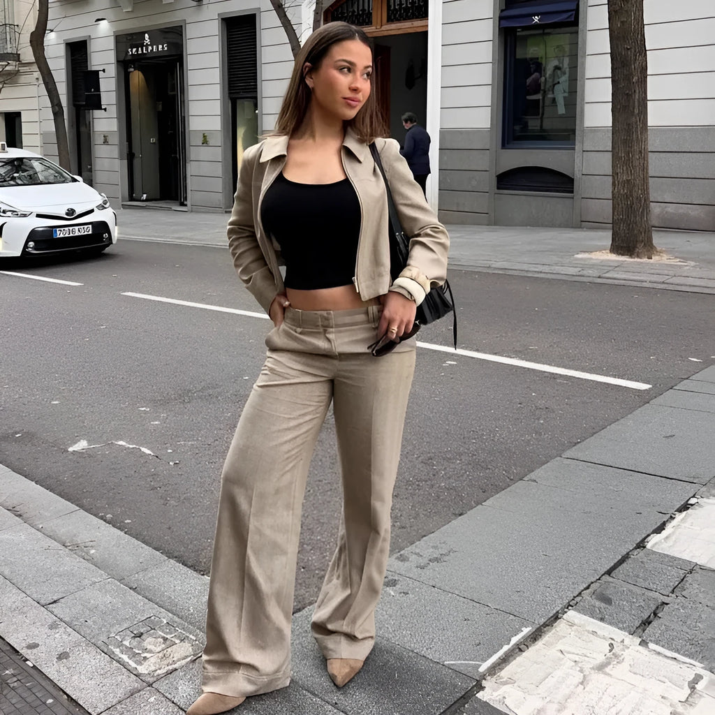 Women's light coloured herringbone pattern summer suit with jacket and straight-leg trousers, showing 3D pattern effect and embroidery details.