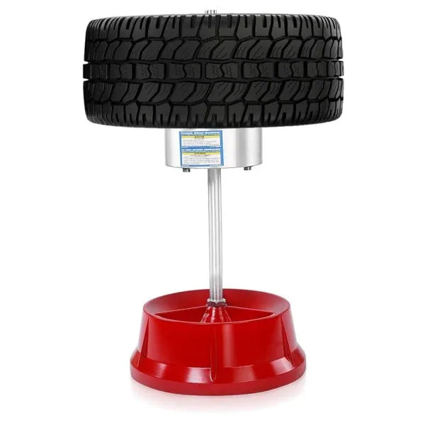 Portable hub balancer tool with aluminium head and enamel-finished base for wheel balancing.