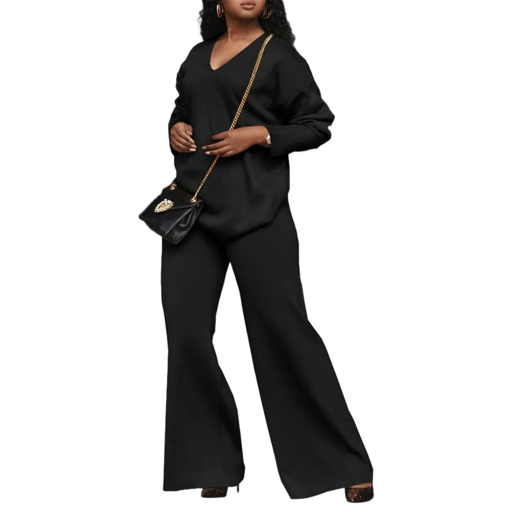 Brown women's suede velvet two-piece suit with long sleeves and full-length trousers on a model.
