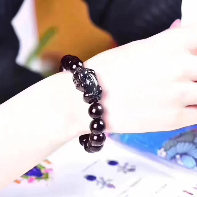 Natural ice colour Eye Obsidian crystal bracelet with elastic band, showing different bead size options.