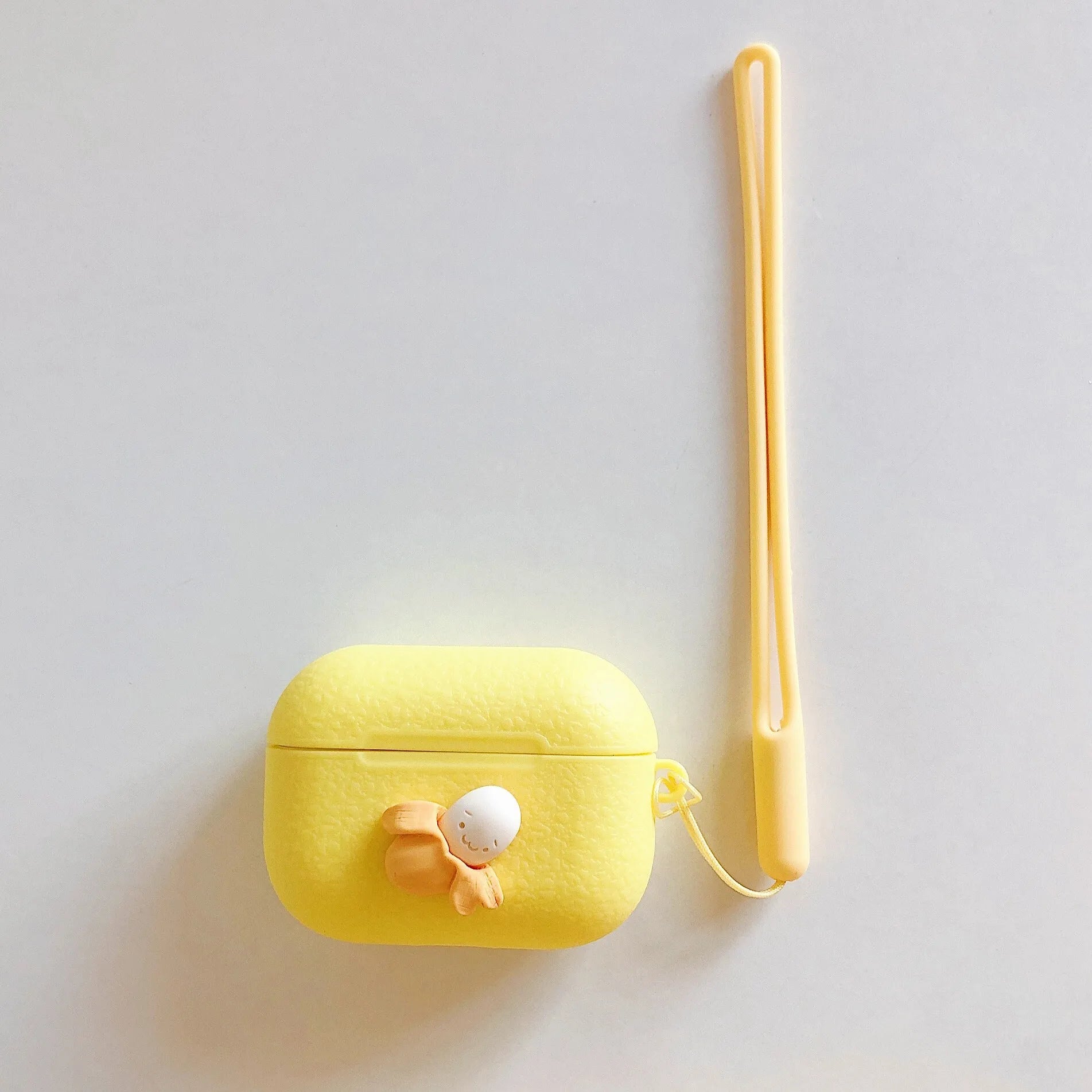 Squeeze the banana graphic on an open banana coloured IMD back cover case for iPhone.