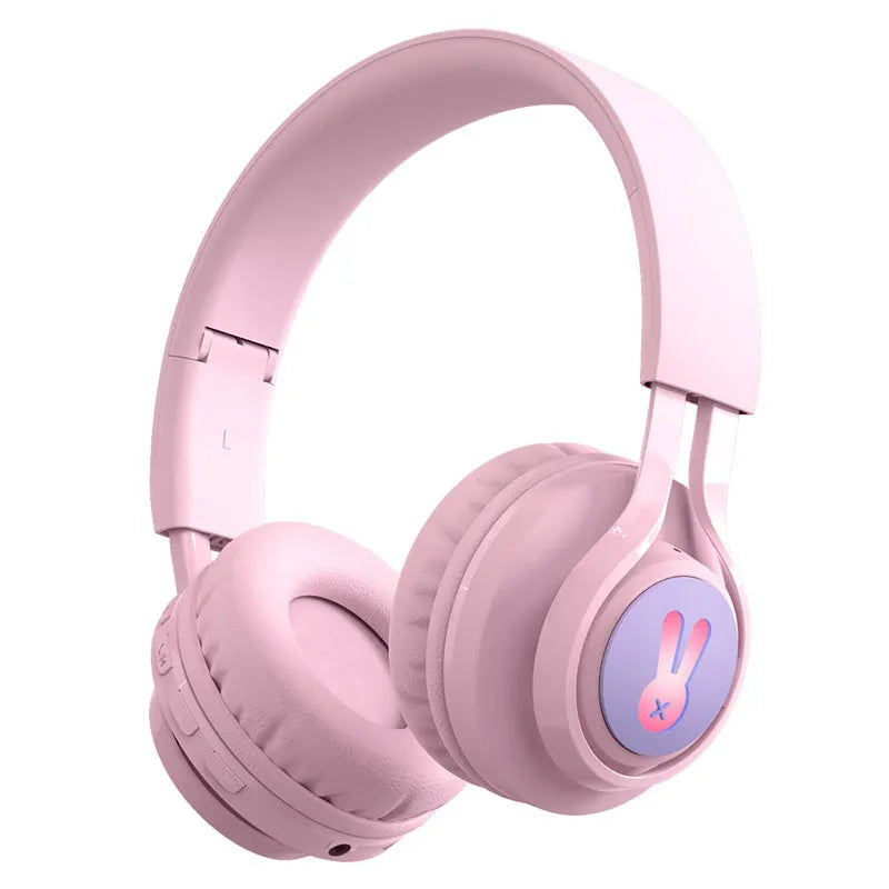 Children's wireless headphones with RGB lights in bunny pink colour showing power display and microphone