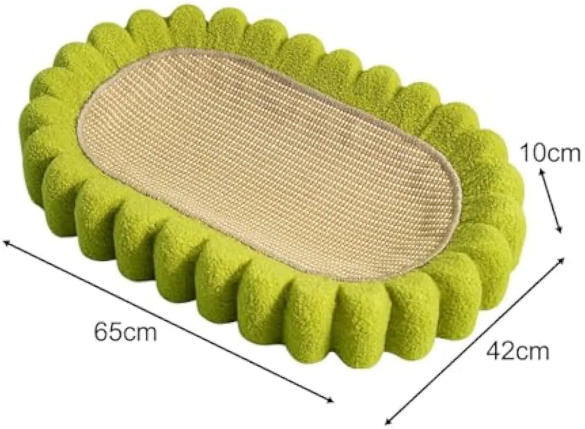 Green oval-shaped cat scratcher pad with sisal surface serving as a scratching area and cat bed.