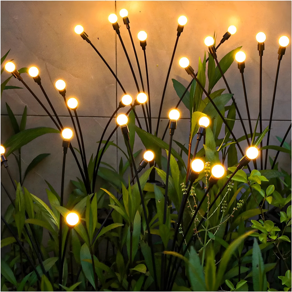 Solar LED firefly garden light with ground spike in warm white or coloured light options