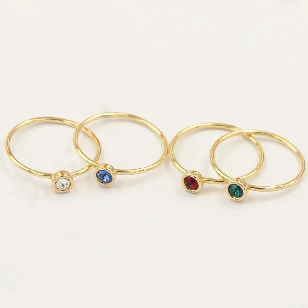 Women's copper knuckle ring with 14K gilded finish and colourful GF zircon stones.