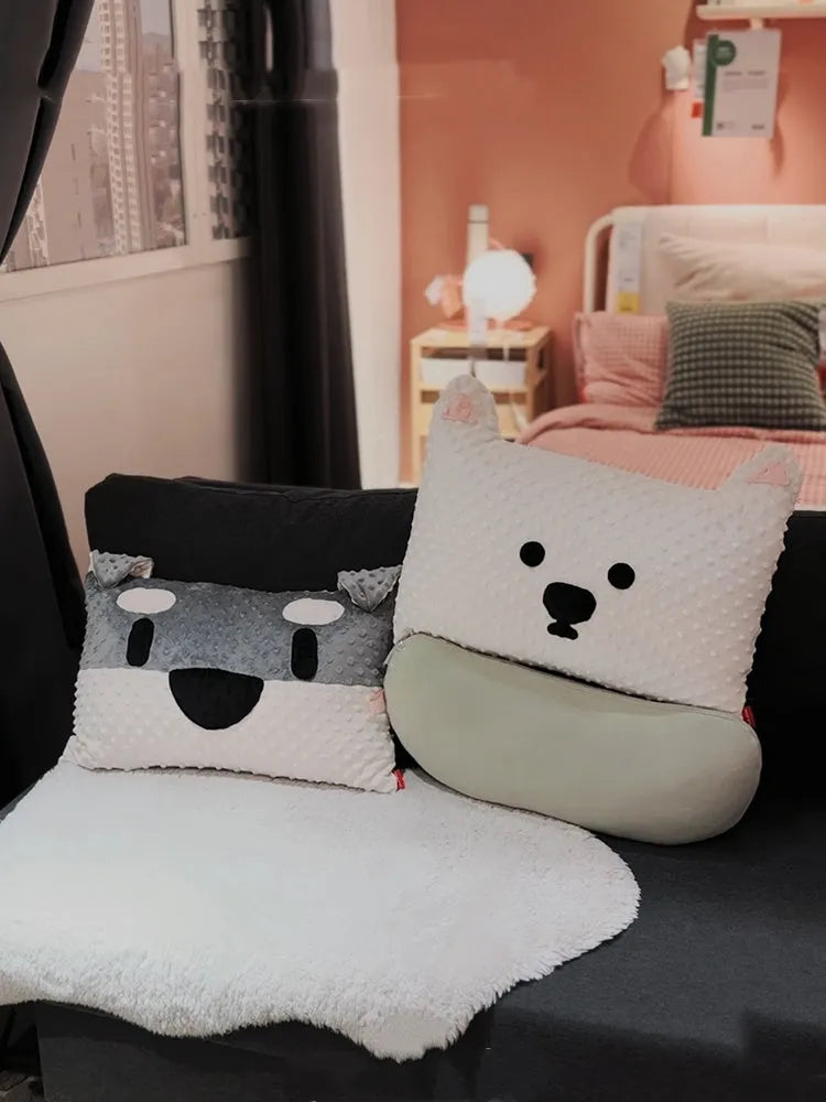 Grey and white West Highland puppy decorative cushion on sofa