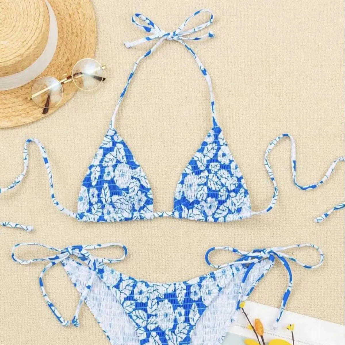 Women's pink floral halter neck bikini swimsuit with briefs on a mannequin.