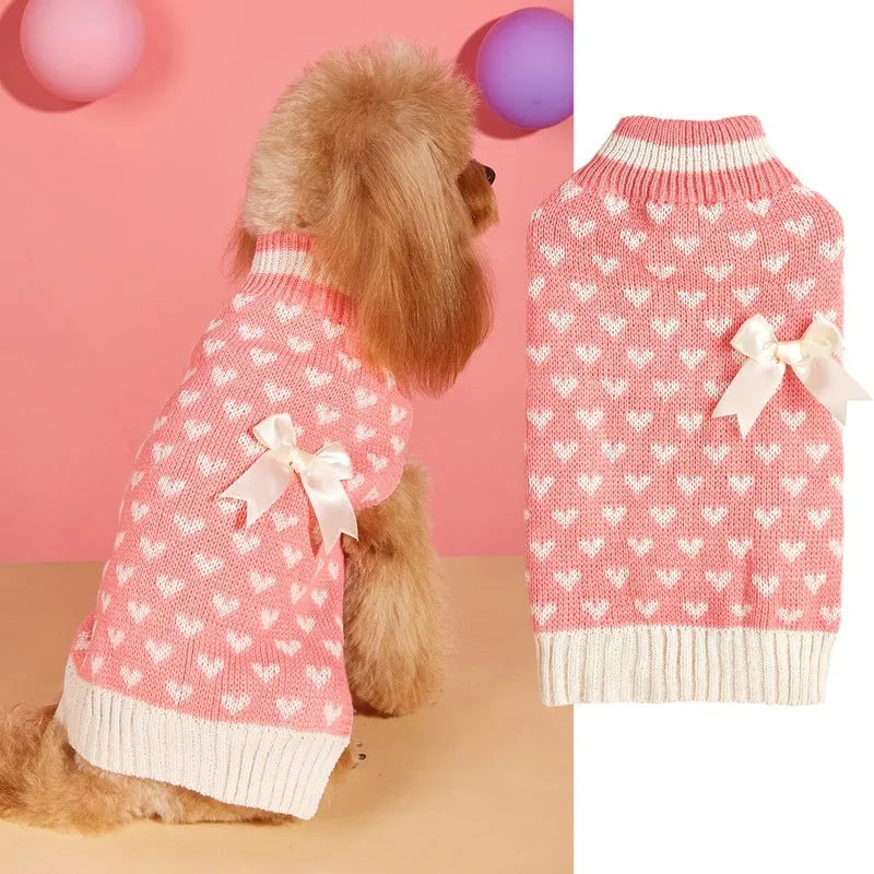 Red dog sweater with a white love heart pattern on the back, sized for a small dog.