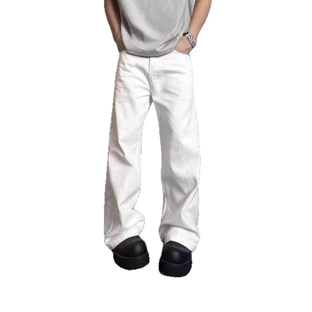 Men's white straight-leg denim jeans on a neutral background, showing mid waist and loose fit.