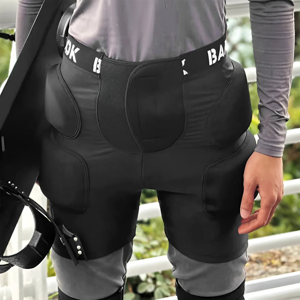 Black protective hip pad made of spandex with NBR foam padding for roller skating and skateboarding.