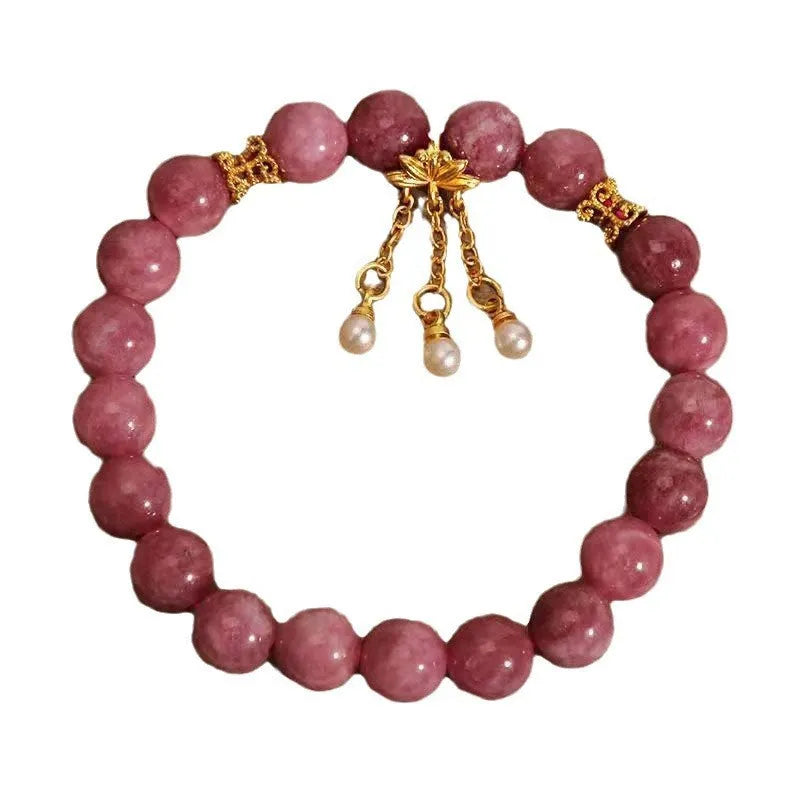 Pink lotus tassel and pearl pendant bracelet with pink white crystal beads in a New Chinese style.