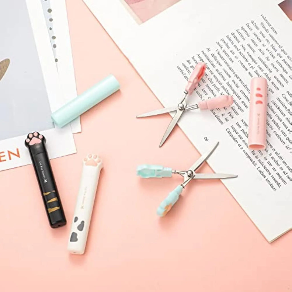 Cat paw mini folding scissors showing stainless steel blades and compact size next to a ruler.