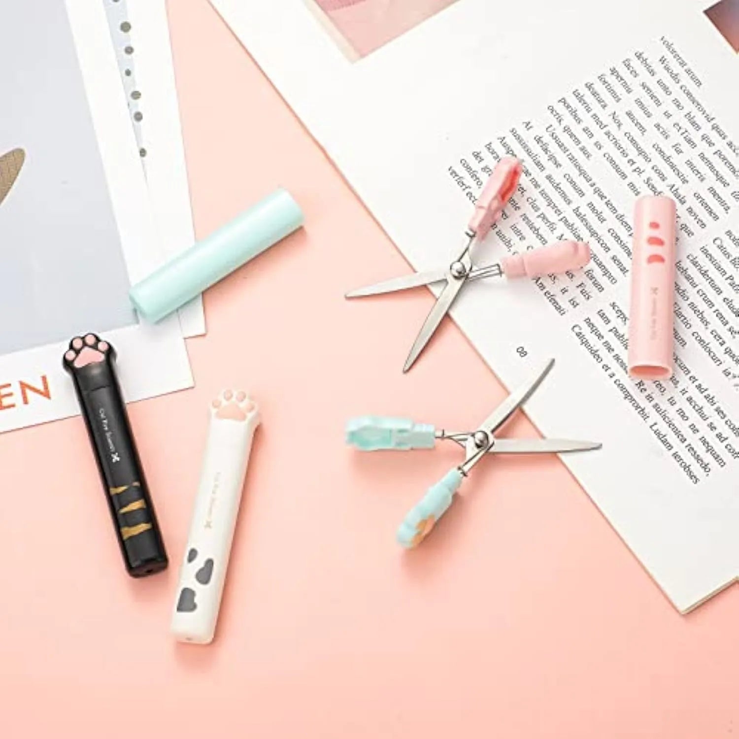 Cat paw mini folding scissors showing stainless steel blades and compact size next to a ruler.