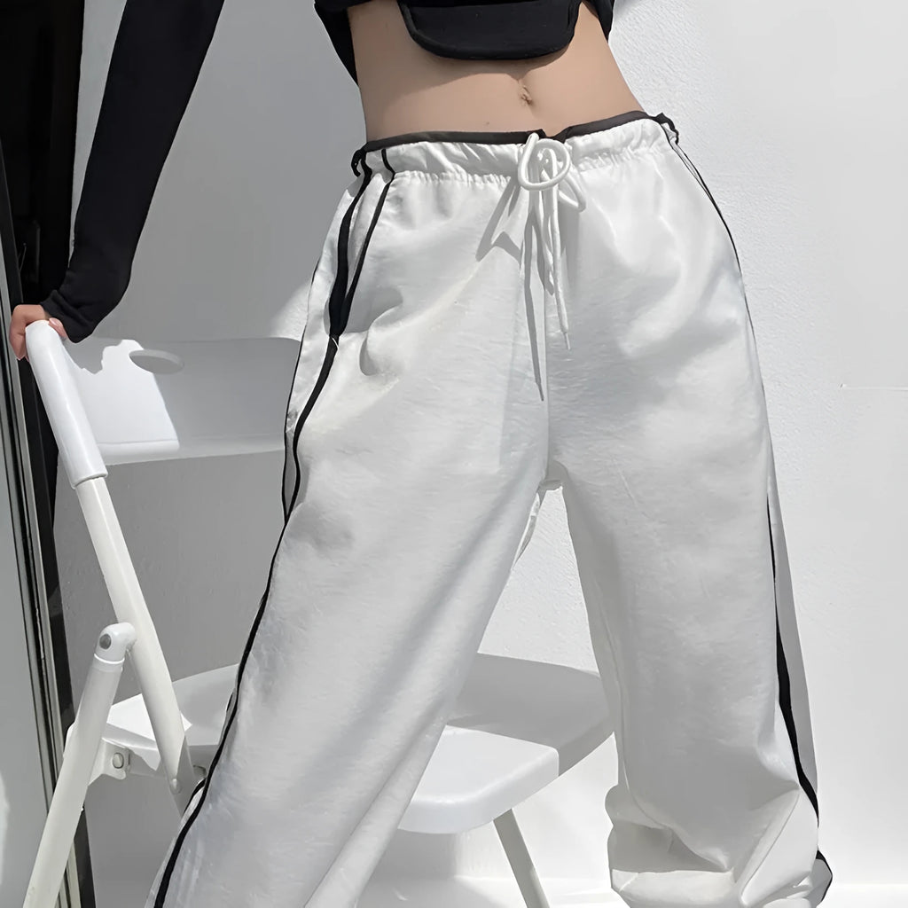 Women's slim drape trousers with contrast ribbon parallel bars detailing and loose straight leg cut