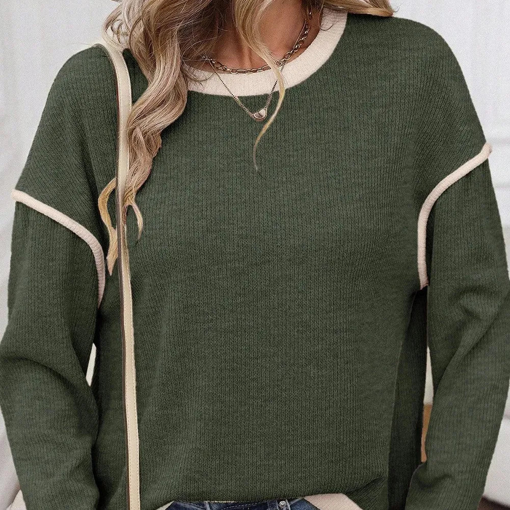 Drop shoulder loose knit top with four leaf clover pattern and contrast colour trim.