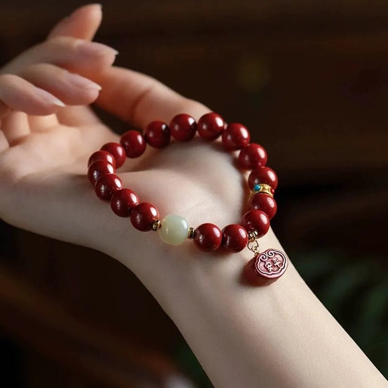 Natural cinnabar bracelet with emperor sandstone Ping An Fu Lu design, shown in 8mm and 10mm bead size options.