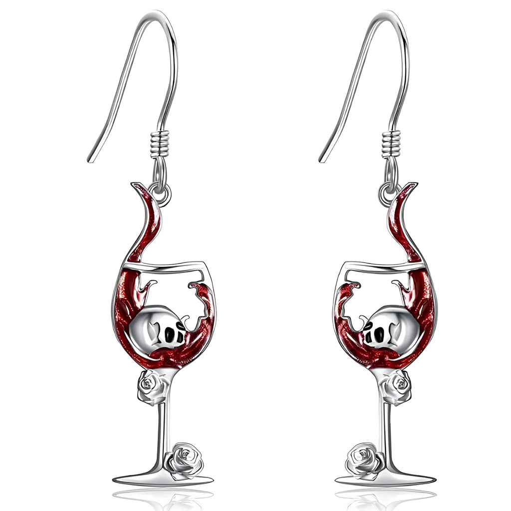 Pair of geometric drop earrings with combined skull and wine glass design in metallic finish.