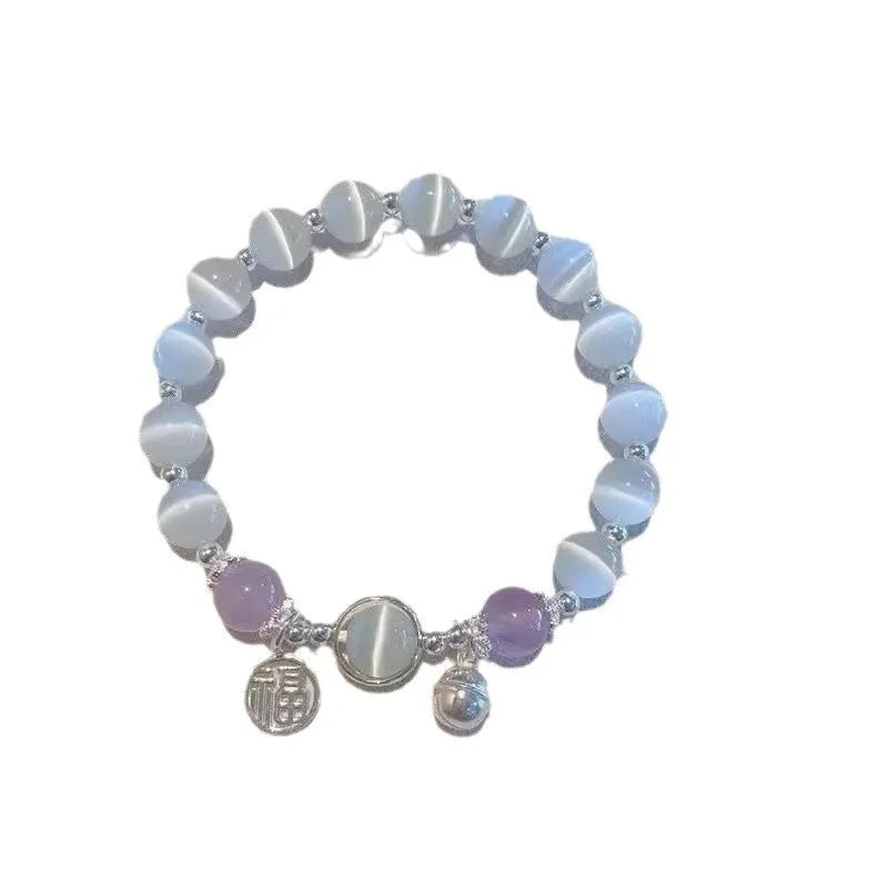 Women's handcrafted glass bead bracelet with butterfly design elements and grey colour tones