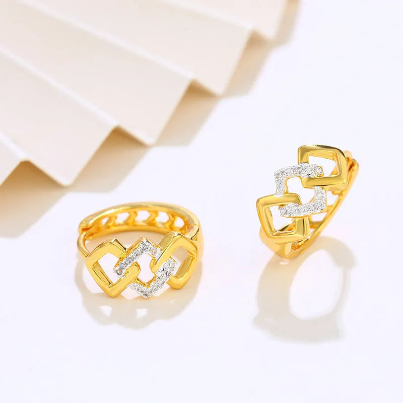 Gold geometric hollow-out earrings with electroplated finish and ear clip fastening