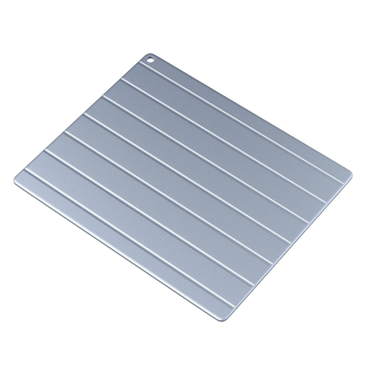 Household aluminium quick defrosting plate device on a kitchen countertop.
