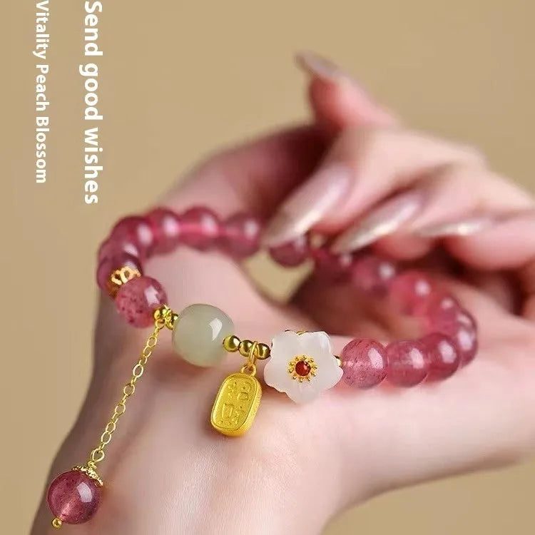 Handmade strawberry quartz crystal bracelet with Hetian jade peach blossom charm for women