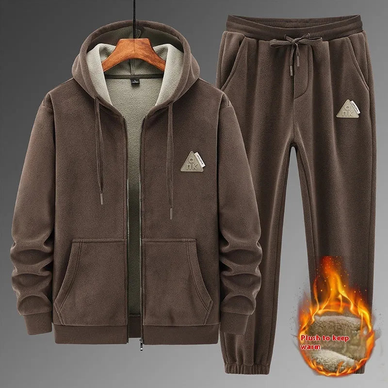 Grey men's hooded sweater and matching trousers casual sports suit set on a hanger.