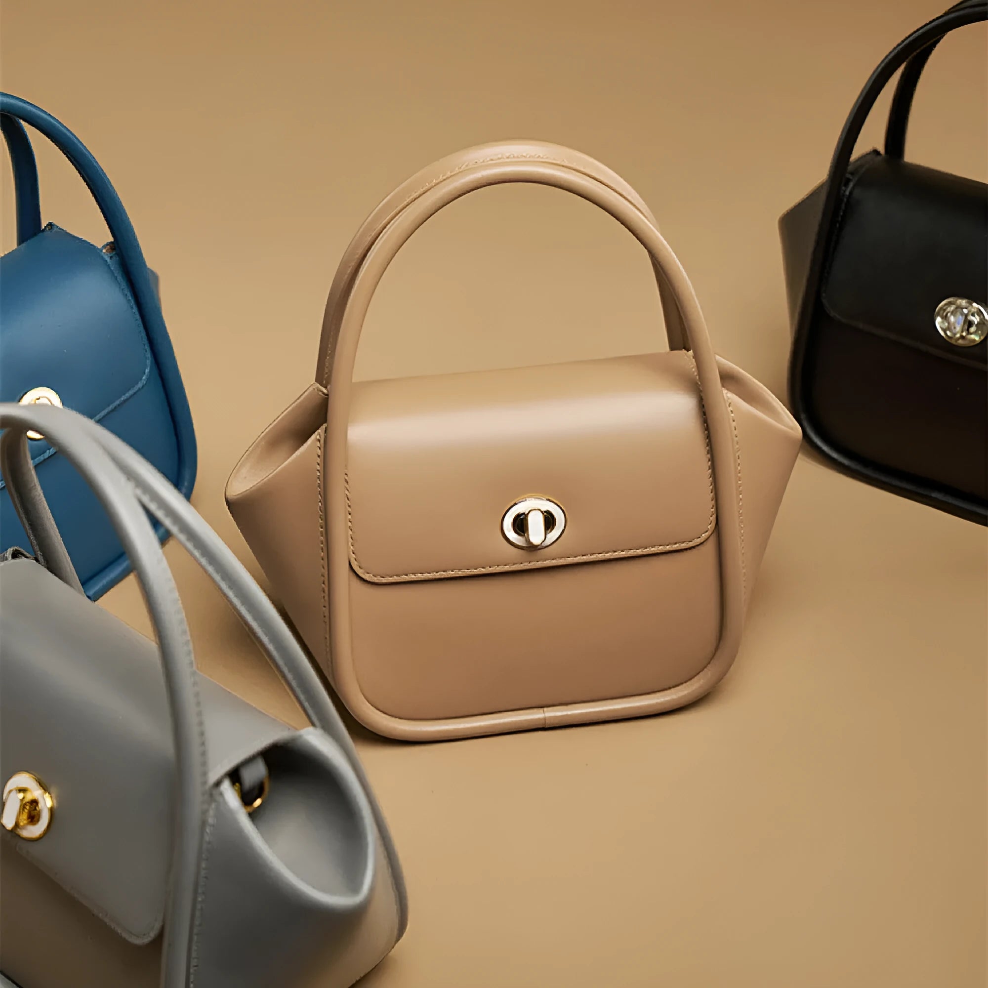 Women's leather cross-body wing bag with buckle closure in four colour options