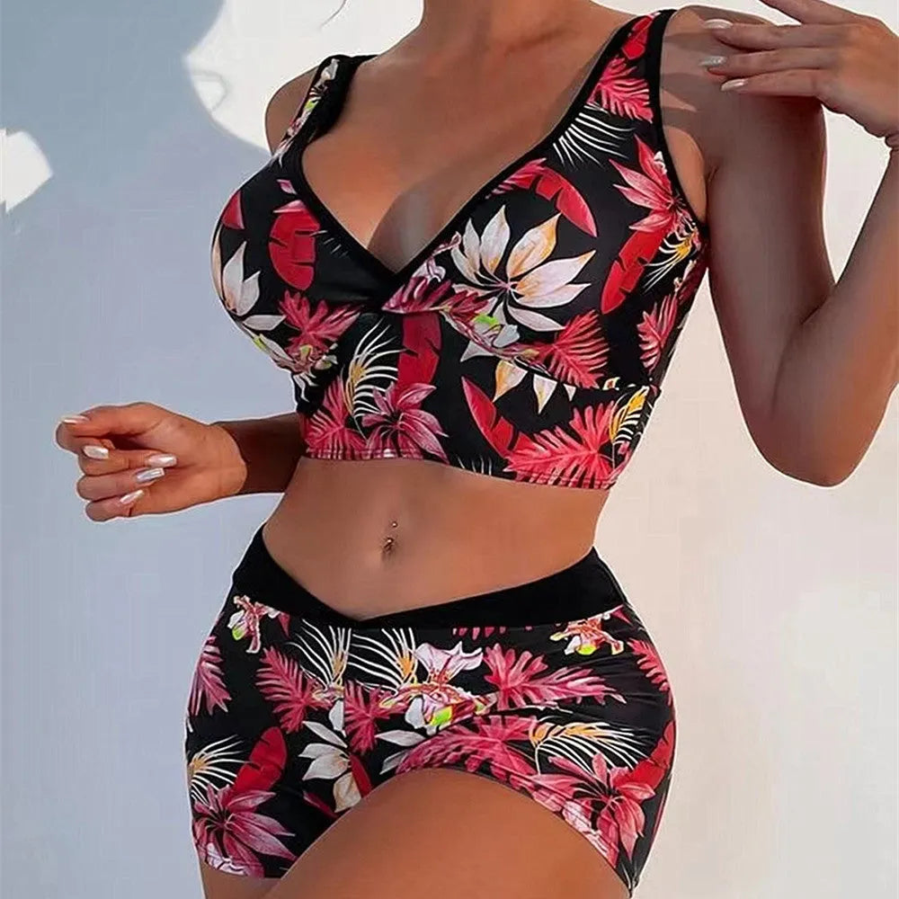 Women's two-piece printed boxer swimsuit set in a colourful style, showing sleeveless top and briefs.