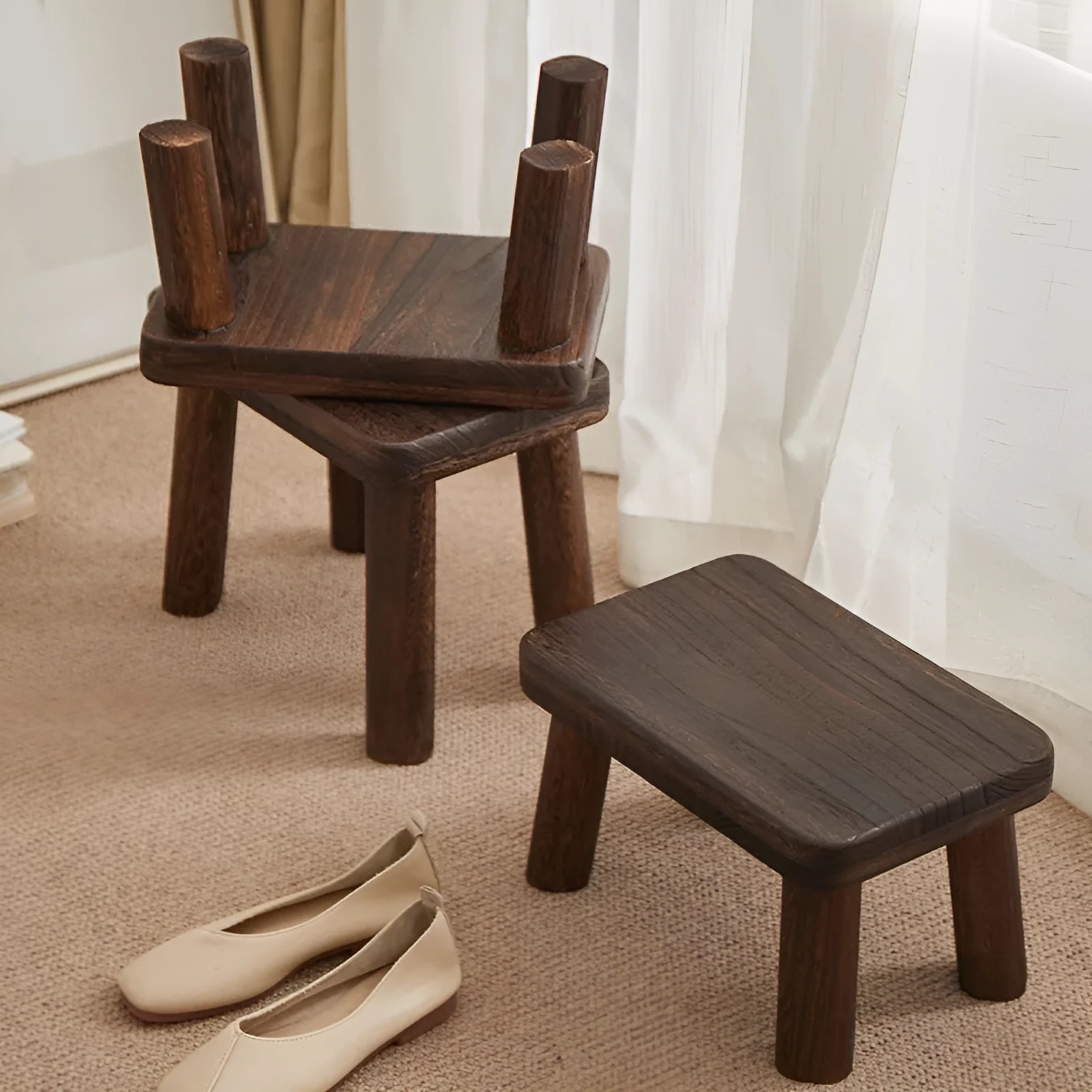Solid wood household changing stool with a distressed wooden finish.