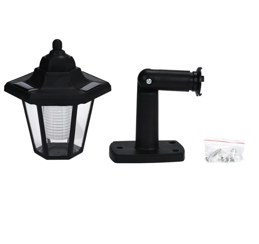 Black hexagonal solar wall lamp for outdoor garden or patio mounting