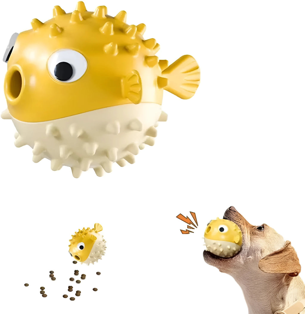Green fish-shaped dog toy with treat dispensing cavity and raised surface particles