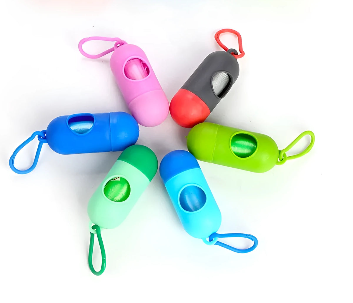 Roll of coloured dog waste bags showing black, blue, green, and pink options