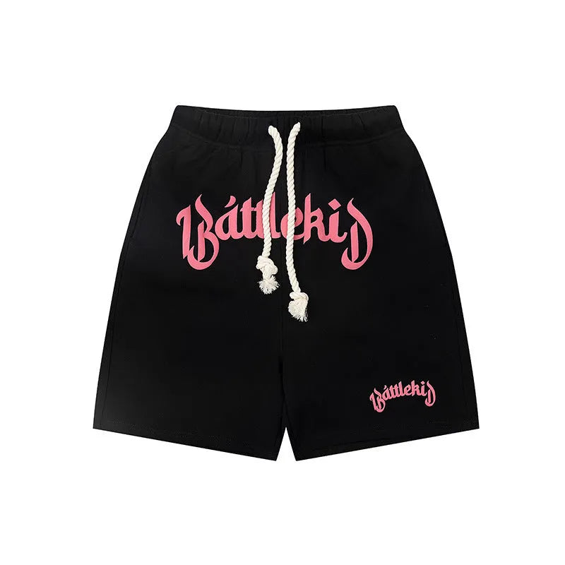 Loose fit cotton blended shorts in black, shown on a model for street style.