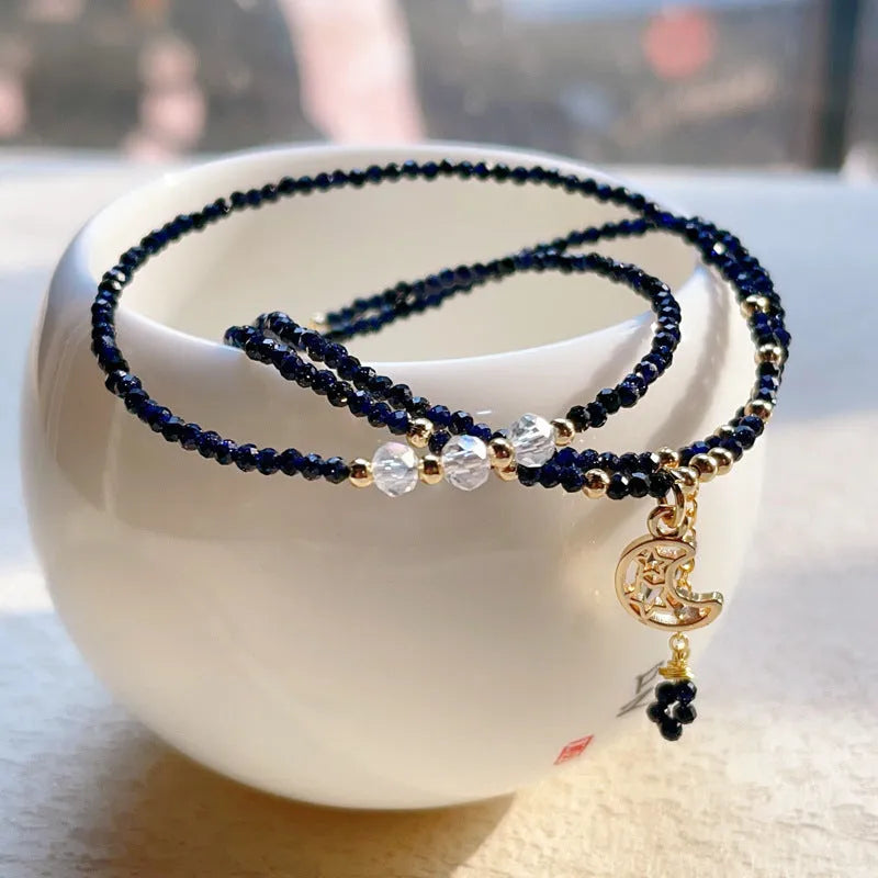 Women's blue and gold three-ring multi-layer bracelet with sand stone beads.