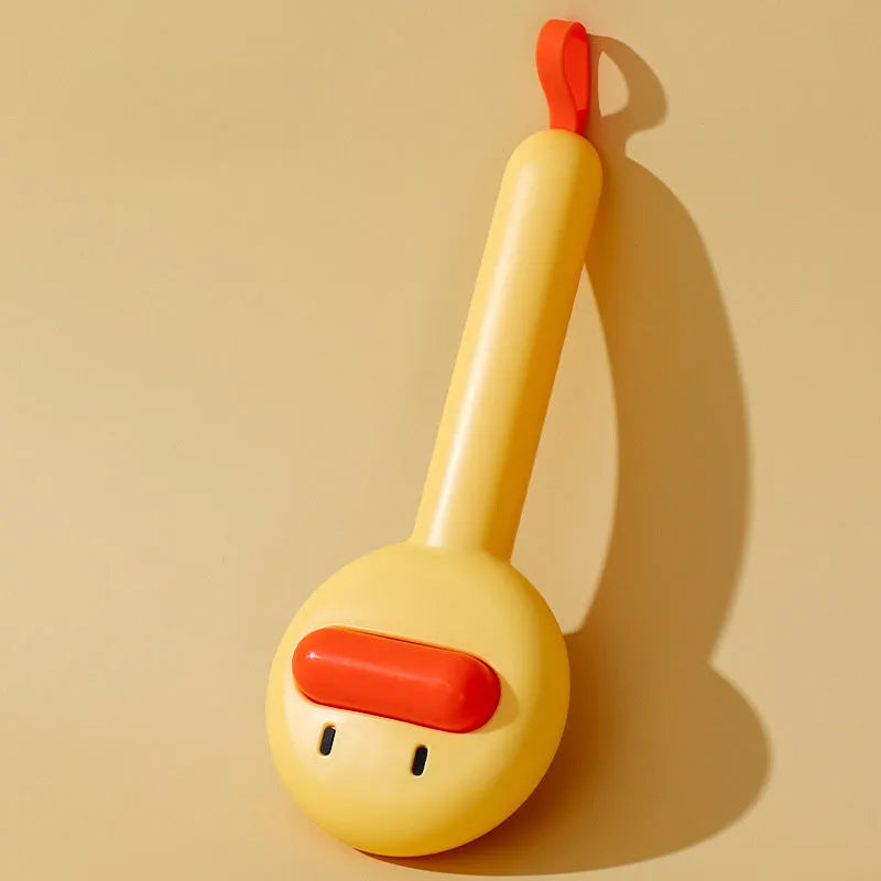 Small yellow duck-shaped pet comb with detachable needle teeth for cat and dog grooming.