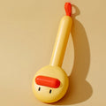 Small yellow duck-shaped pet comb with detachable needle teeth for cat and dog grooming.