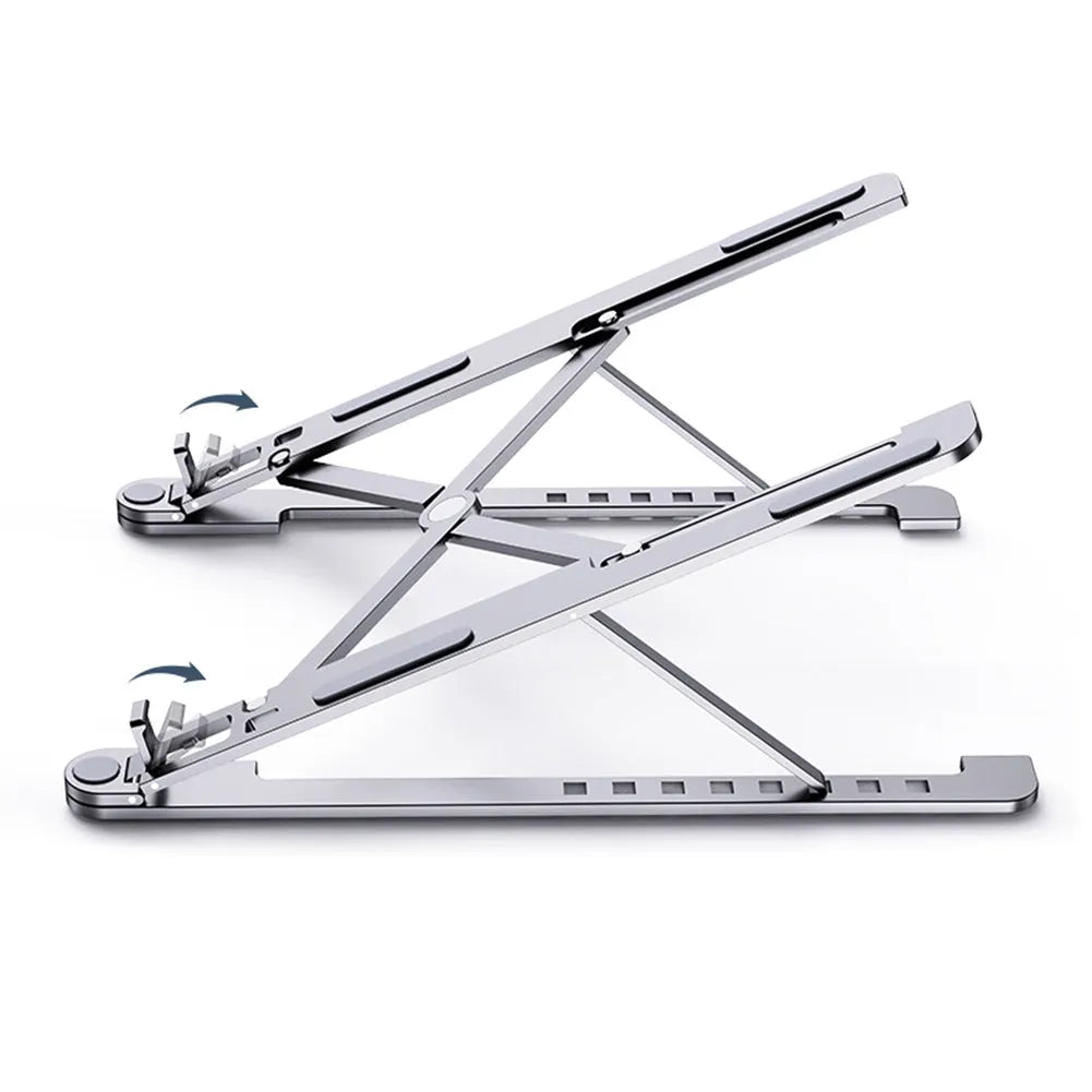 Aluminum alloy laptop stand in silver colour, folded to show its slim profile next to a 15-inch laptop.
