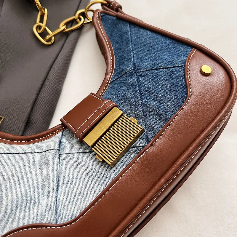 Brown denim women's shoulder bag with diamond mesh pattern and chain detail showing bucket shape