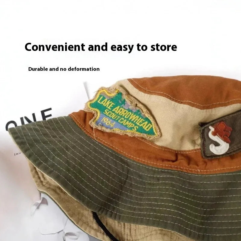 Army green foldable fisherman hat with patchwork design and flat top crown