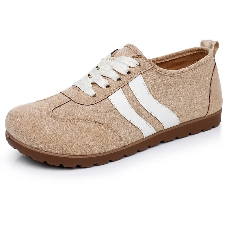 Women's vintage-style sneakers in dark red with a canvas upper and round toe.